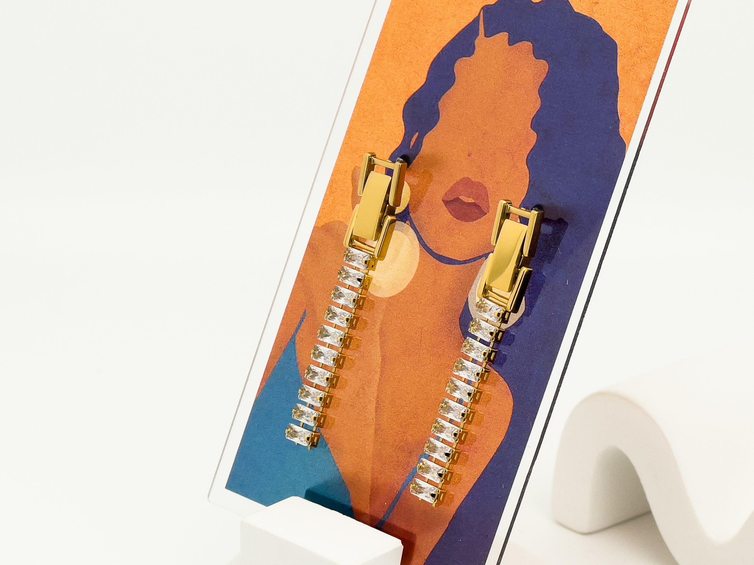 Diamond on gold buckle drop earrings